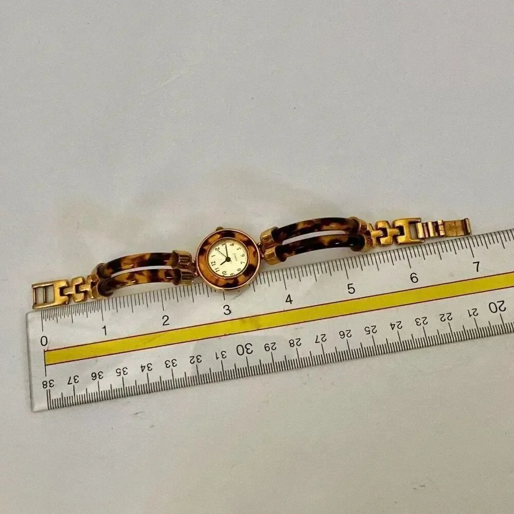 Avon faux tortoise vintage watch/ bracelet.